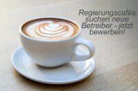 Das Foto zeigt eine Kaffeetasse und den Schriftzug Regierungscafés suchen neue Betreiber - jetzt bewerben.